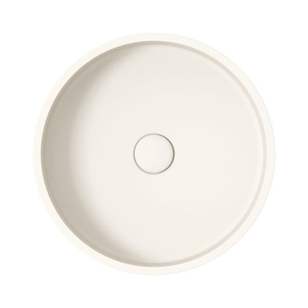 Round white kitchen sink with central drain hole for modern kitchen design.